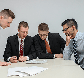 Business professionals collaborating on documents